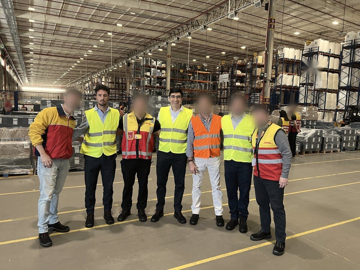 David Herrera with an operations team on a warehouse floor