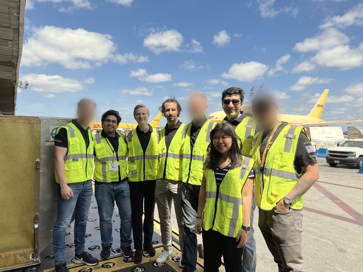 David Herrera with a team on an airport cargo ramp