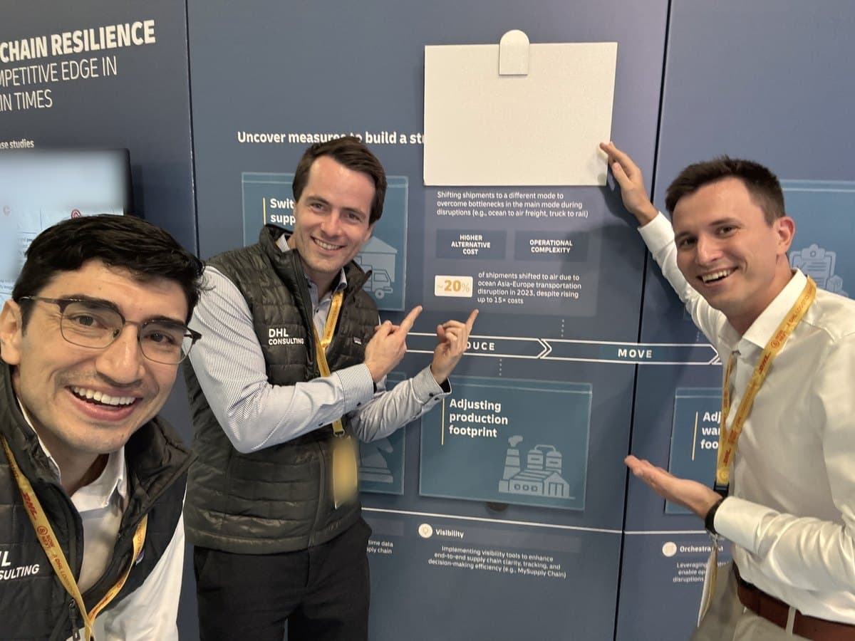 David Herrera with two colleagues at a conference booth