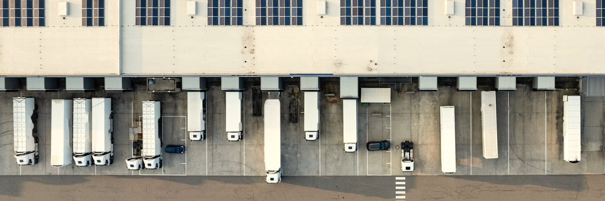 Trucks at the loading docks of a distribution center, seen from above